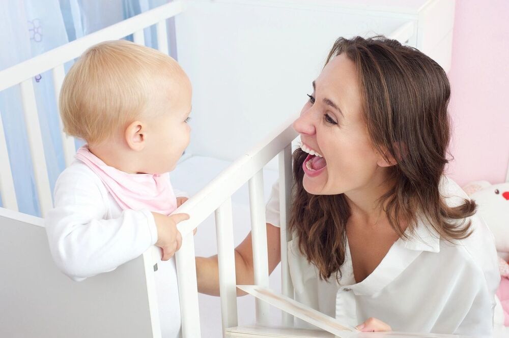 mom and baby smiling