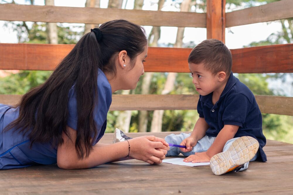 adult and kid at a tree house