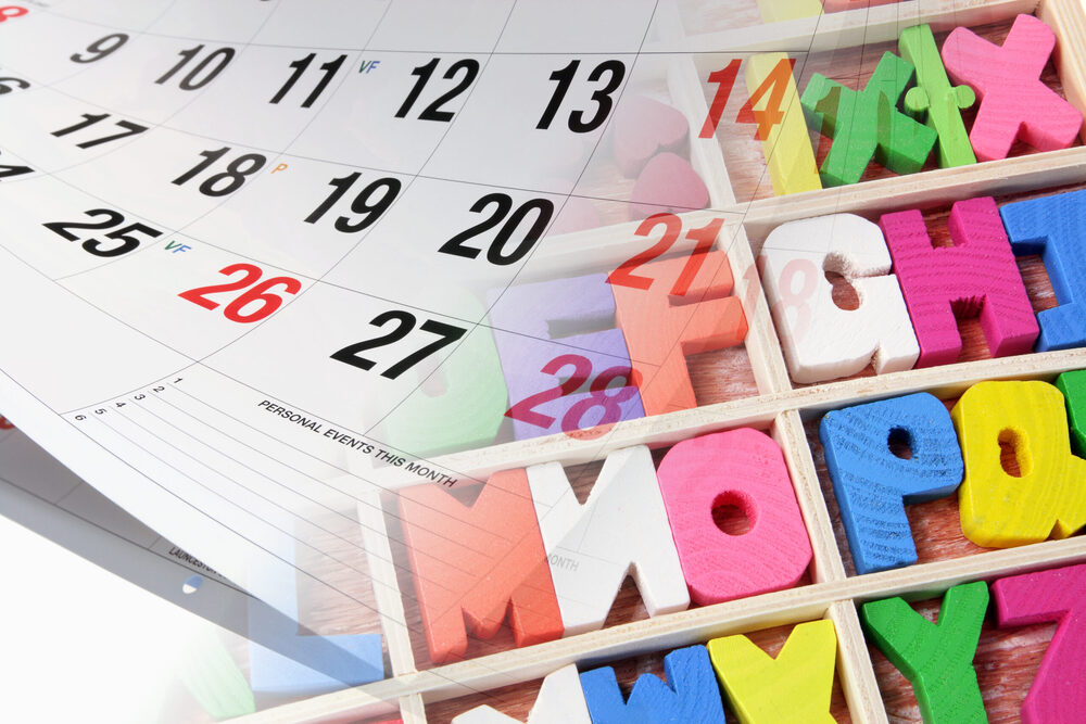 calendar and wooden colored letters