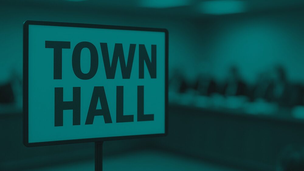 A sign reading "TOWN HALL" stands in the foreground with a blurred meeting room panel in the background, styled with a monochromatic teal overlay.