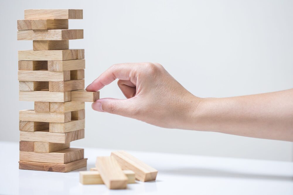 person playing Jenga
