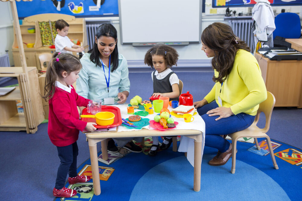 kids playing with teachers