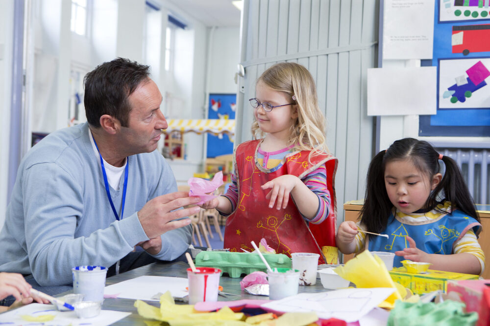 kids with teacher in art class