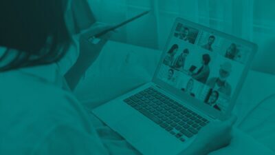 An over-the-shoulder view of a person using a laptop for a video conference call, styled with a monochromatic teal overlay.