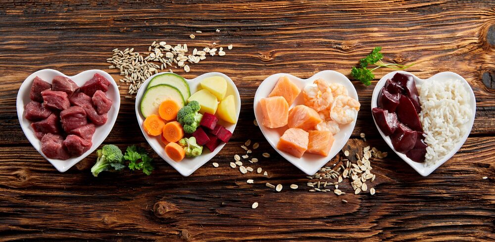 heart-shaped plates with a variety food