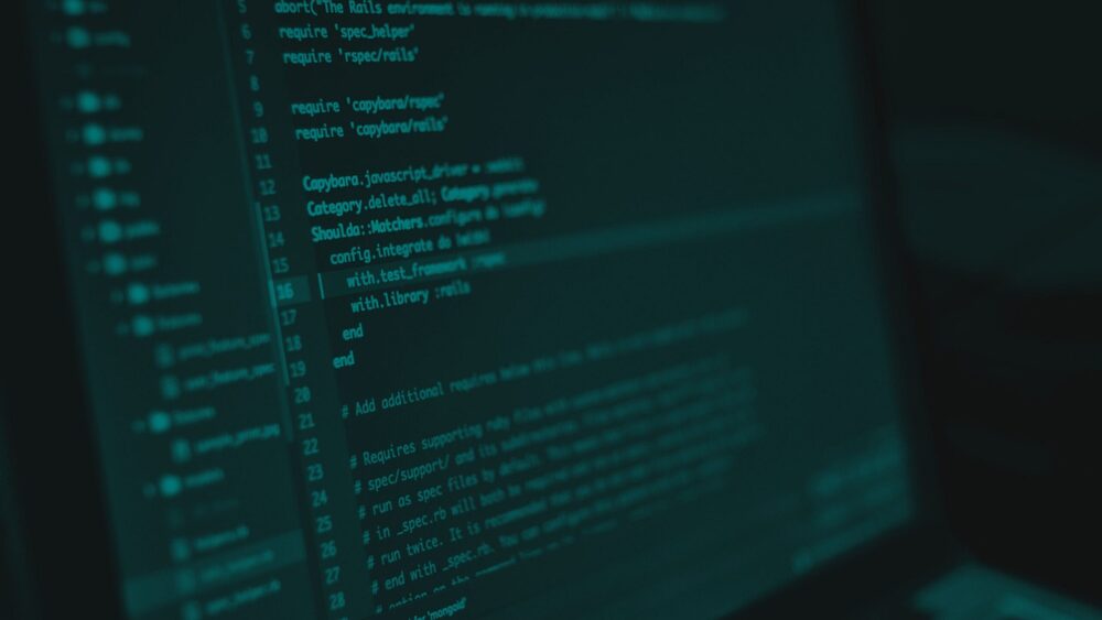 Computer monitor displaying lines of programming code in a software development environment.