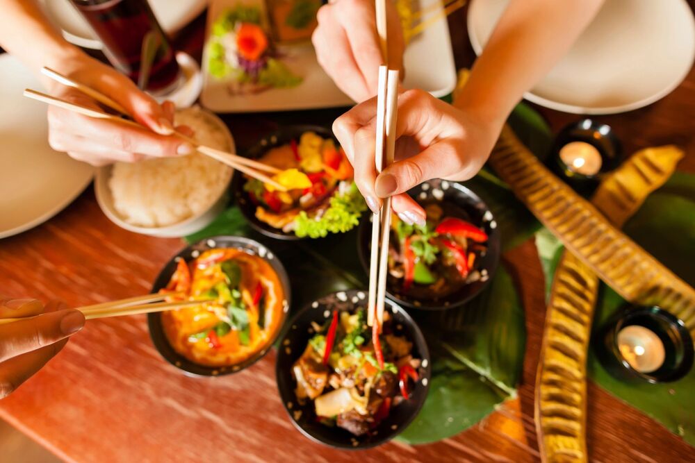 people eating with chopsticks