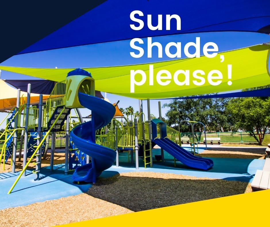Playground with slides and a blue canopy. The text "Sun Shade, please!" is on the upper right.