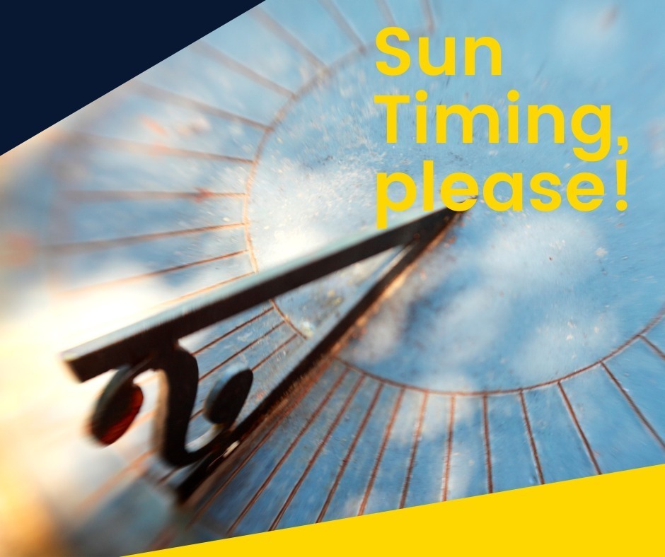 A sundial with a metal pointer positioned on a blue sky background. Text overlay reads "Sun Timing, please!".