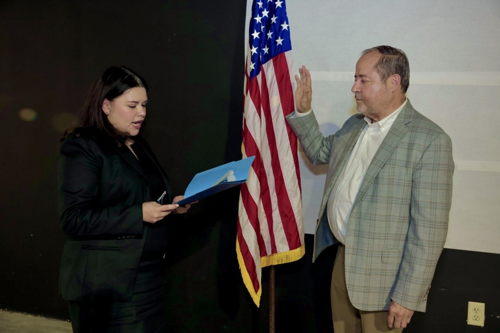 board member being sworn in