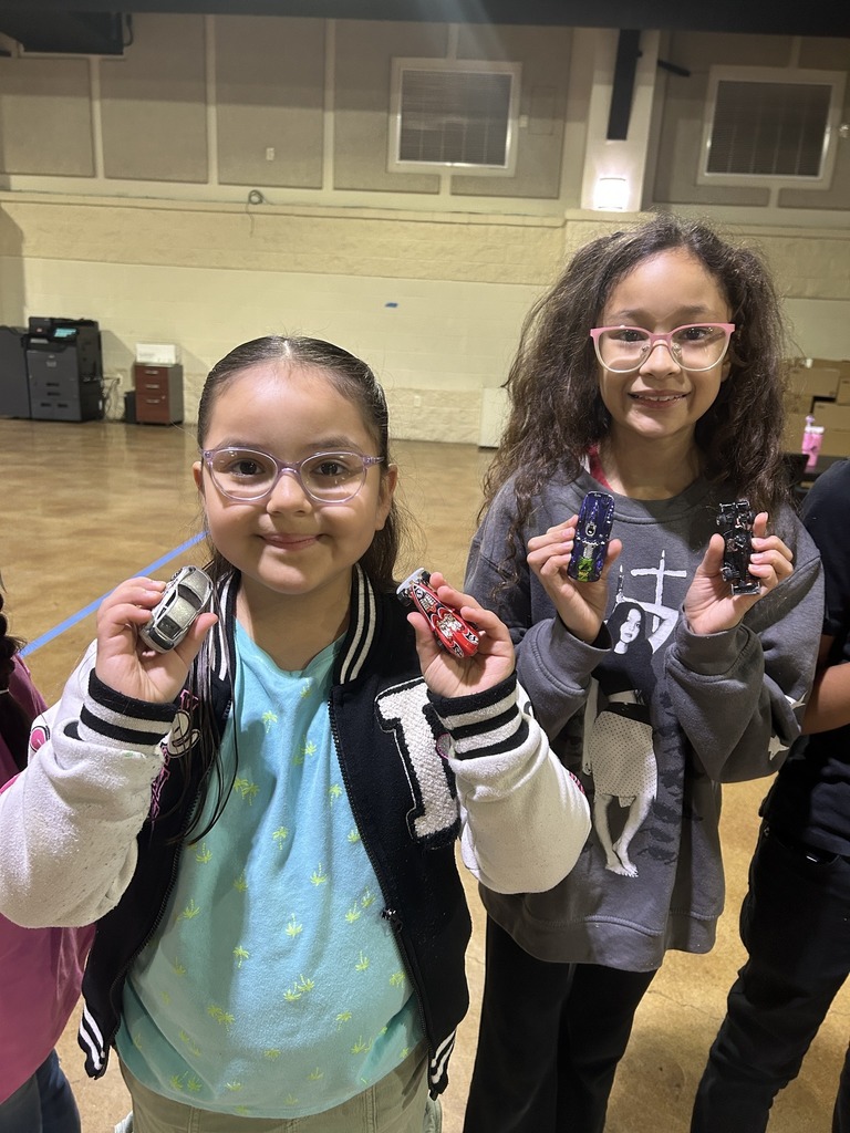 two children posing with toys