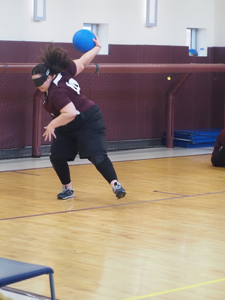A VSDB student is in the motion of throwing a ball