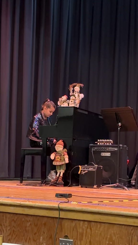 A student plays at the piano 