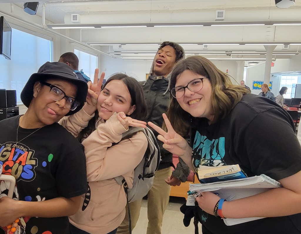 students make funny faces and pose with peace signs