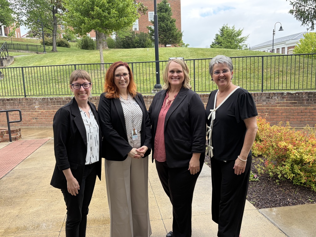 Lindsay Burris, Dr. Kate Maxlow, Senior Advisor to the Secretary of Education, Julie Conner, and Charity Reedy Warigon stand outside at VSDB.