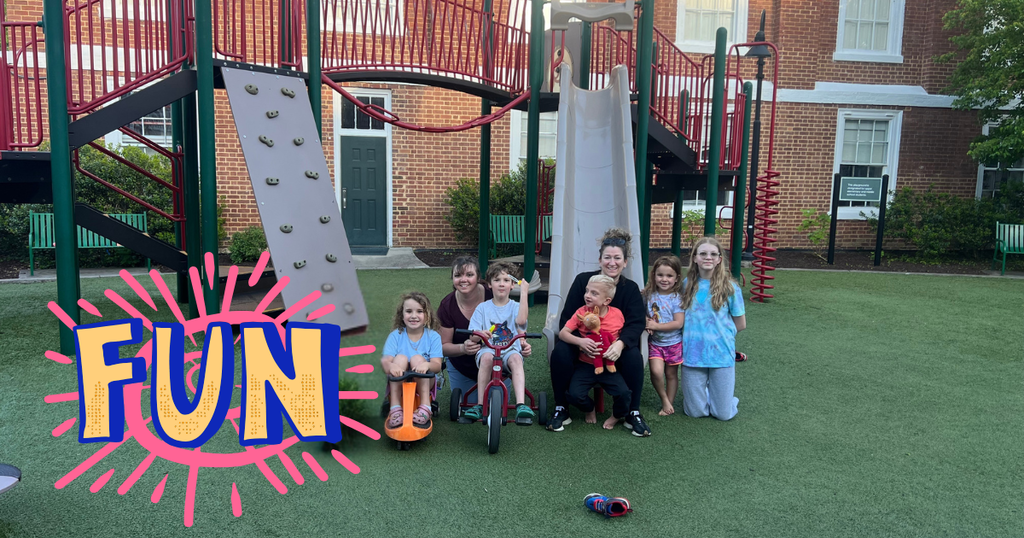 group lined up on the playground and smiling for the camera