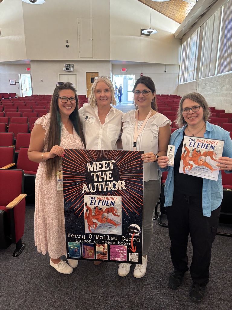 four women: Julie Saum, Kerry, Kayla Watson and Jennifer (bookseller from the Book Dragon) posing with Kerry's "Meet the Author" sign and The Gallaudet Eleven book.