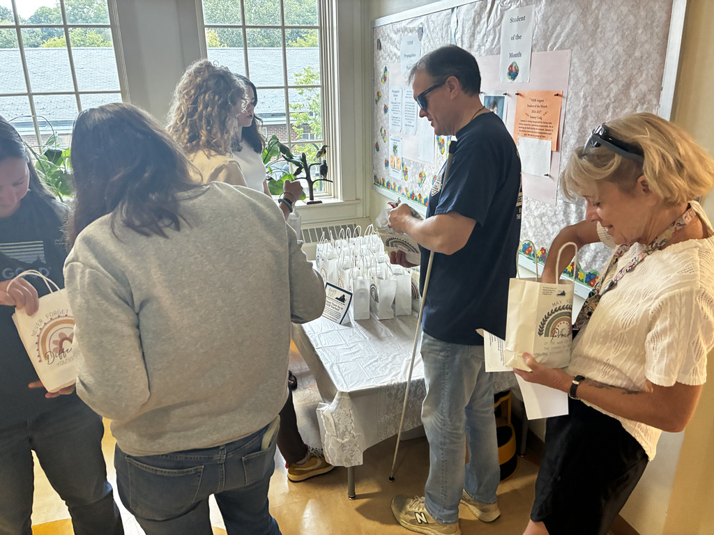 group of staff looking through their goodie bags