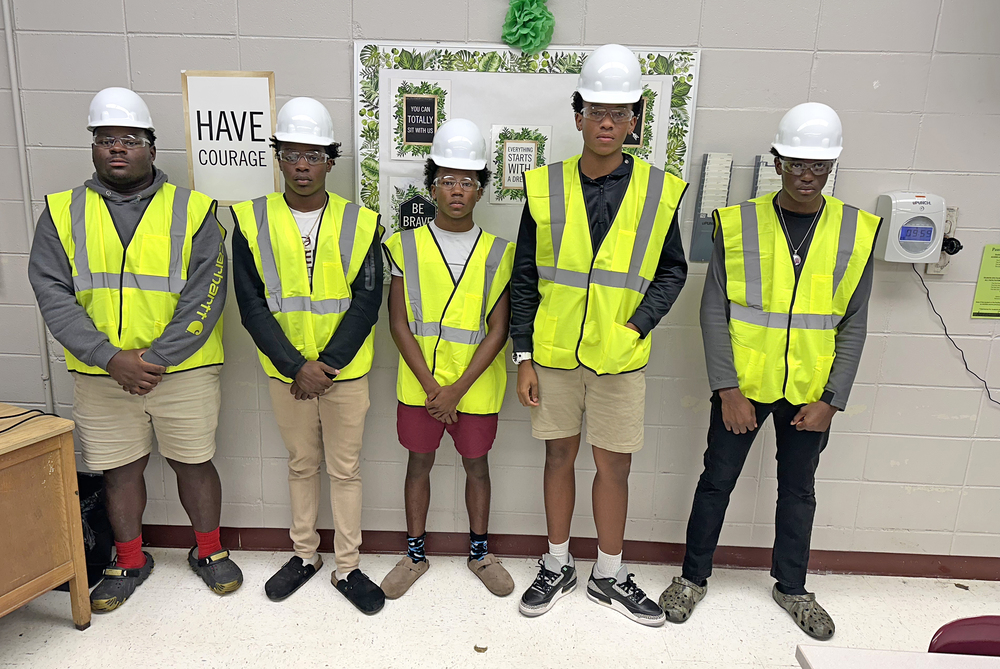(Photo cutline: Zamarion Taylor, Christopher Rowden, Corey Hosea, Leonard Robinson and Ja'Keim Clark, students in the Modern Manufacturing program at Thomasville High School, are wearing gear donated to all the program students by Burkes Mechanical.)