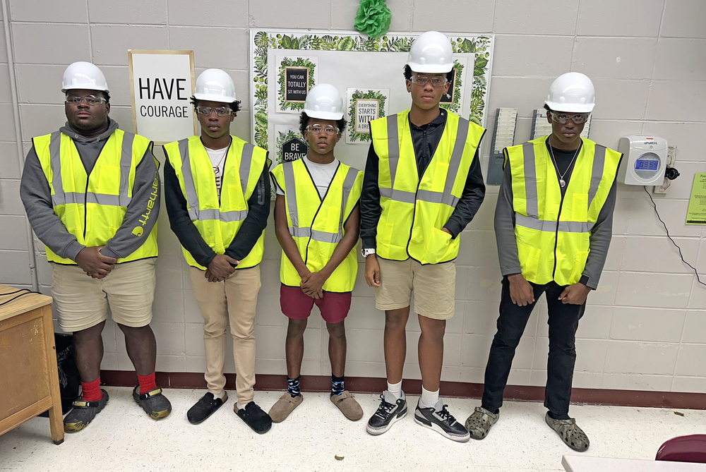 (Photo cutline: Zamarion Taylor, Christopher Rowden, Corey Hosea, Leonard Robinson and Ja'Keim Clark, students in the Modern Manufacturing program at Thomasville High School, are wearing gear donated to all the program students by Burkes Mechanical.)