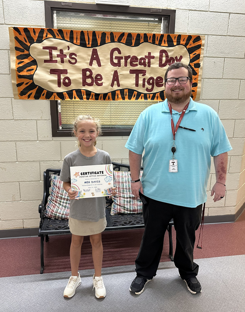Meg Davis, a third grade student in teacher April Kilpatrick's third grade class at Thomasville Elementary School, received a "Positive Office Referral" on Aug. 21 as she "displayed responsibility and leadership" by helping cleanup the cafeteria during breakfast. She is pictured with John Sheffield, TES Assistant Principal.