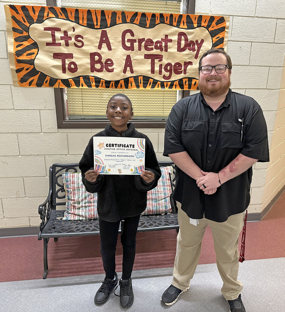 Kansas Richardson, a third grade student at Thomasville Elementary School, has received a Positive Office Referral because she "displayed responsibility, respect, kindness and cooperation" in being a leader in teacher Ginger Shehan's classroom. She is pictured with John Sheffield, TES Assistant Principal.