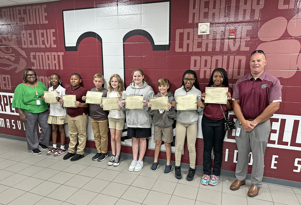 "Students of the Month" for August 2025 at Thomasville Middle School include August Cowan and Karter Kirksey, Fifth Grade; Ryan Drinkard and Tina Johnson, Sixth Grade; Tensley Stauffacher and Garrett Andrews, Seventh Grade; and Iriyana Smith and D'Arielle Holt, Eighth Grade. They are pictured with Renae Williams, TMS Assistant Principal; and Brad Elam, TMS Principal.