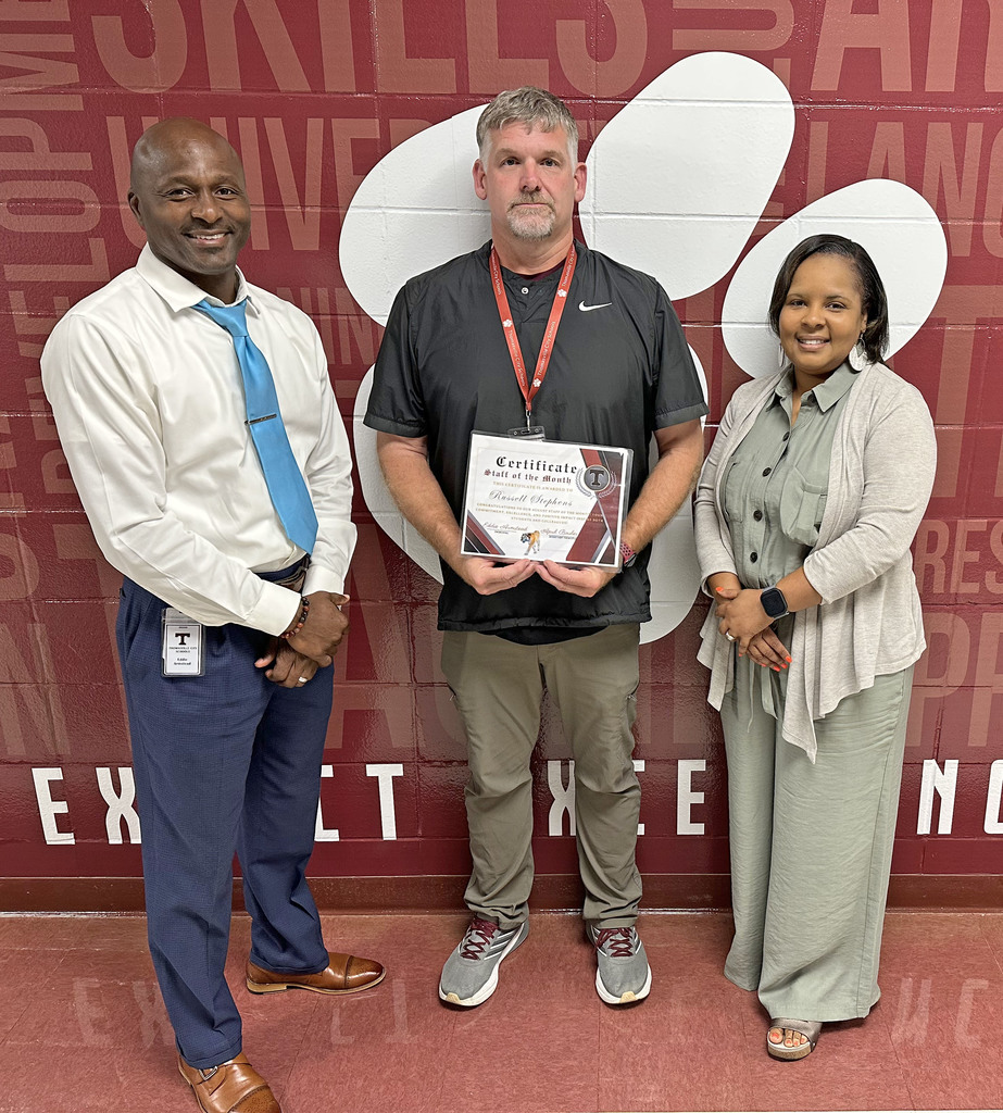 Russell Stephens (center), history teacher and coach, has been selected as the "Staff Member of the Month" for September 2025 at Thomasville High School. He is pictured with Eddie Armstead Jr., THS Principal; and April Bouler, THS Assistant Principal.