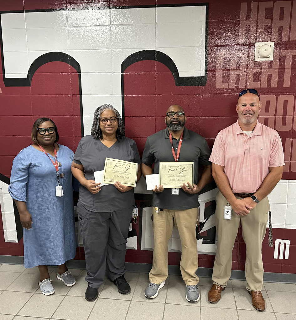 Danielle Pugh and James Howard (center), custodians at Thomasville Middle School, were honored Oct. 2 in recognition of National Custodian Day. They are pictured with Renae Williams, TMS Assistant Principal; and Brad Elam, TMS Principal.