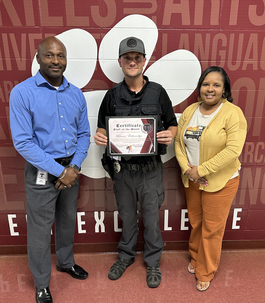 Harris Etheridge (center), School Resource Officer, has been chosen as the "Staff Member of the Month" for October 2025 at Thomasville High School. He is pictured with Eddie Armstead Jr., THS Principal; and April Bouler, THS Assistant Principal.