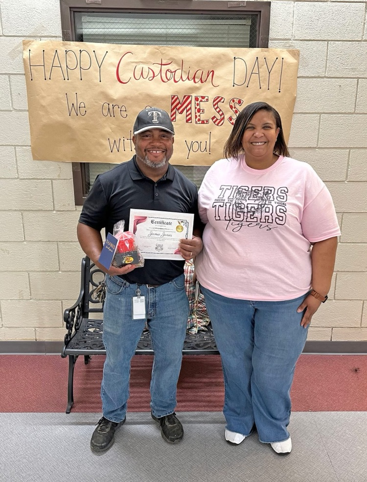 Jamie Jones (center), custodian at Thomasville Elementary School, has been honored in recognition of National Custodian Day. He is pictured with Melissa Washington, TES Principal.