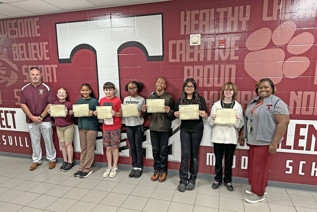 "Students of the Month" for October 2025 at Thomasville Middle School include Kyleigh Motes, Fifth Grade; Emma Anderson and Jaxton Barron, Sixth Grade; Marlayshia Berry and Abner Burroughs, Seventh Grade; and Hannah Contreras and Miriam Pugh, Eighth Grade. They are pictured with Brad Elam (left), TMS Principal; and Renae Williams (right), TMS Assistant Principal. Not pictured is Jad Doggett, Fifth Grade.