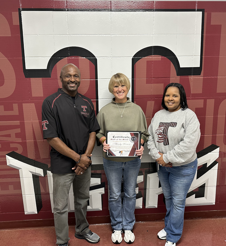 Wendy Norton (center), Special Education Teacher, has been selected as the "Staff Member of the Month" for November 2025 at Thomasville High School. She is pictured with Eddie Armstead Jr., THS Principal; and April Bouler, THS Assistant Principal. November 2025 is "Thank Alabama Teachers Month," declared by the Alabama State Department of Education.