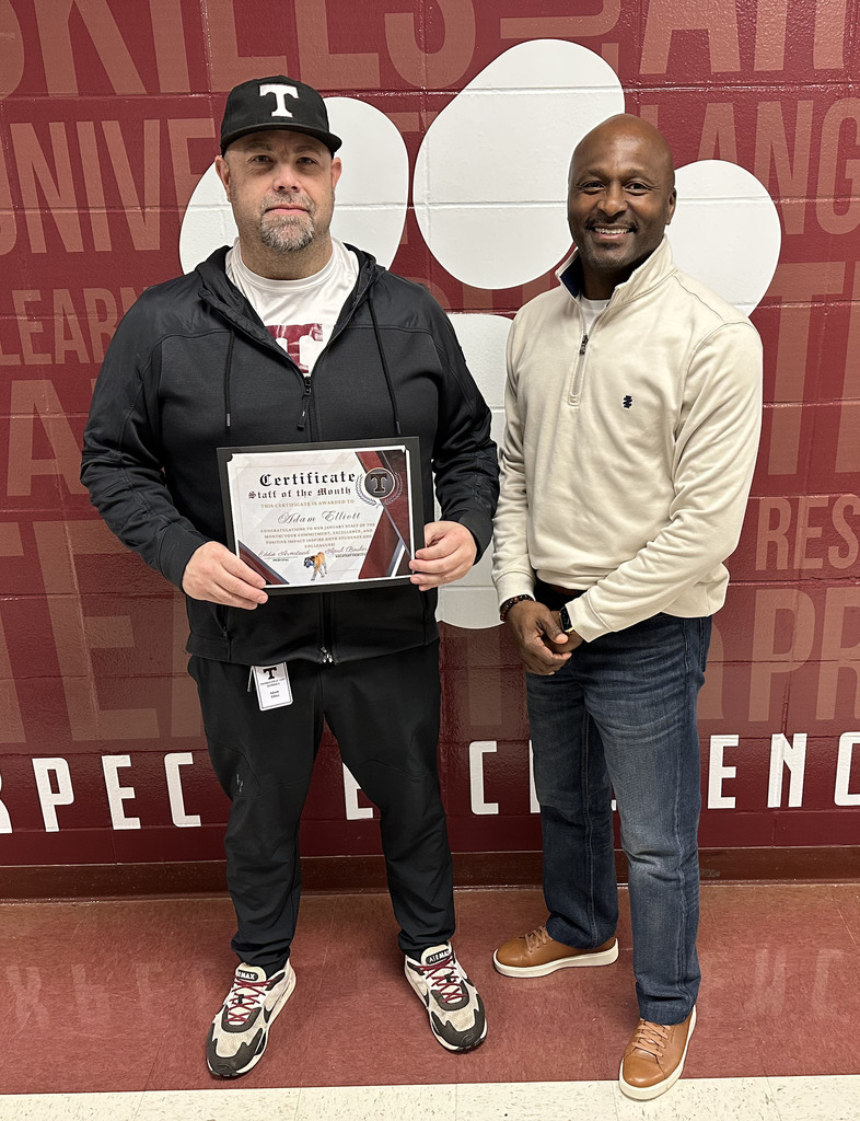 Adam Elliott (left) has been chosen as the "Staff Member of the Month" for January 2026 at Thomasville High School. Elliott serves as an assistant football and softball coach, co-Athletic Director as well as the Safety and Family/Community Outreach Coordinator for the Thomasville City Schools District. He is pictured with Eddie Armstead Jr., THS Principal.
