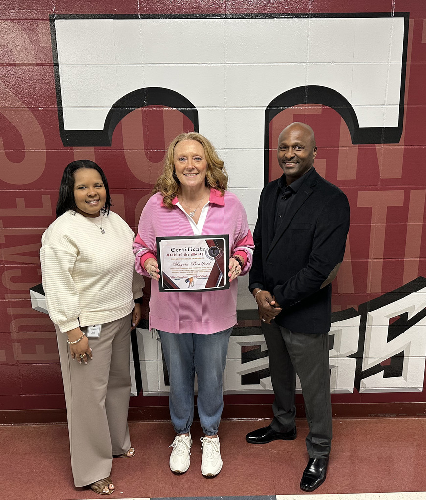 Angela Bradford (center), Instructional Aide, has been selected as the "Staff Member of the Month" for February 2026 at Thomasville High School. She is pictured with April Bouler, THS Assistant Principal; and Eddie Armstead Jr., THS Principal.