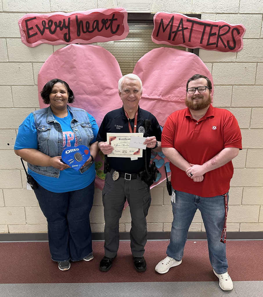 Charles Burge (center), School Resource Officer, was honored for his effort to make the employees and students safe at Thomasville Elementary School. He was honored in recognition of National School Resource Officer Day. Burge is pictured with Melisa Washington, TES Principal; and John Sheffield, TES Assistant Principal.