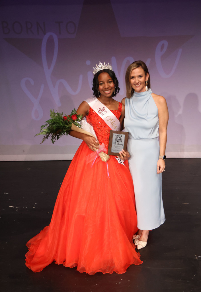 Chelsea Doggett (right), emcee of the TMS Beauty Review 2026, is pictured with Khloe Rice, Top Beauty of the Seventh/Eighth Grade Division.