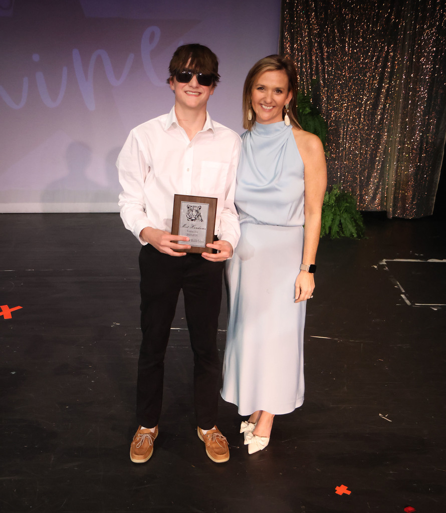 Connor Dunham was chosen as the Top Tuxedo Boys Feb. 28 at the TMS Beauty Review. He is pictured with Chelsea Doggett, emcee of the program.