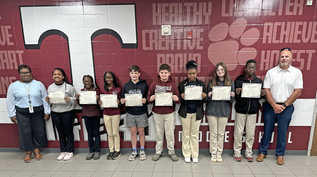 "Students of the Month" for March 2026 have been chosen for March 2026: Nadia Christmas and Reign Bennett, Fifth Grade; Januari Blanks and Carson Elam, Sixth Grade; S.J. Snow and Genesis Norwood, Seventh Grade; and Whitney Kearney and Chad Cade, Eighth Grade. They are pictured with Renae Williams, TMS Assistant Principal; and Brad Elam, TMS Principal.