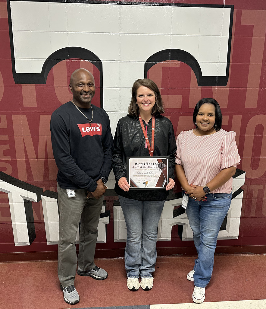 Hannah Dozier (center), Science Teacher, has been selected as the "Staff Member of the Month" for May 2026 at Thomasville High School. She is pictured with Eddie Armstead Jr., THS Principal; and April Bouler, THS Assistant Principal.