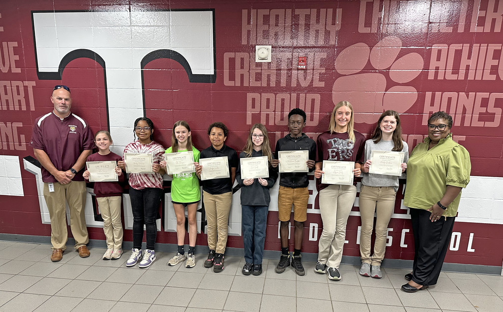 "Students of the Month" for April 2026 at Thomasville Middle School: Ann Davis and Hailey Norwood, Fifth Grade; Ellie Thompson and Jordyn Walker, Sixth Grade; Lanie Smith and TaMauri Besteda, Seventh Grade; and Adyson Dailey and Hailey Goodman, Eighth Grade. They are pictured with Brad Elam, TMS Principal; and Renae Williams, TMS Assistant Principal.