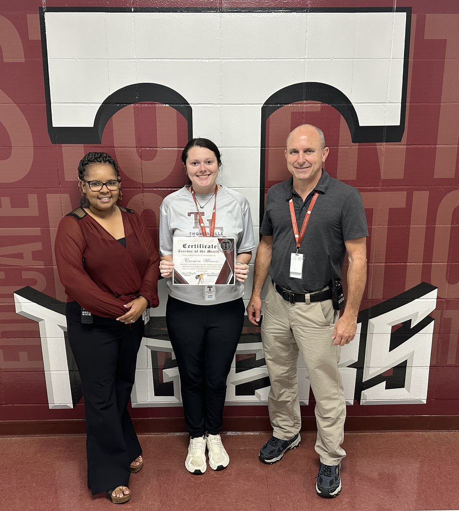 Carmen Maness, Math Teacher, has been chosen as the "Teacher of the Month" for September 2026 at Thomasville High School. She is pictured with April Bouler, THS Principal; and Jay Russell, THS Assistant Principal.