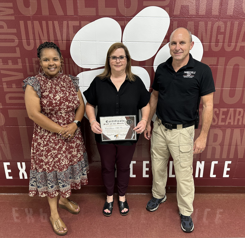 Candace McConnell (center), bookkeeper, has been chosen as the "Staff Member of the Month" for September 2026 at Thomasville High School. She is pictured with April Bouler, THS Principal; and Jay Russell, THS Assistant Principal.