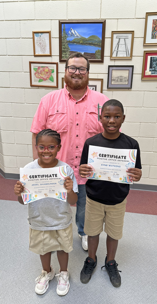The Administration at Thomasville Elementary School has received "Positive Referrals" for Ariel Shamburger (left), first grade student, and Kyng Watkins (right), fourth grade student, for displaying kindness and leadership. They are pictured with John Sheffield, TES Assistant Principal.