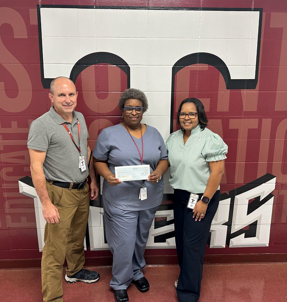 The Health Science career tech program at Thomasville High School has received a $5,000 grant from Blue Cross Blue Shield - the Caring Foundation. The grant will be used to purchase equipment for the classroom. There are plans to purchase a training manikin and IV Venipuncture Arm sets. Pictured are Jay Russell, THS Assistant Principal; Vickie Charleston, THS Health Science teacher; and April Bouler, THS Principal.