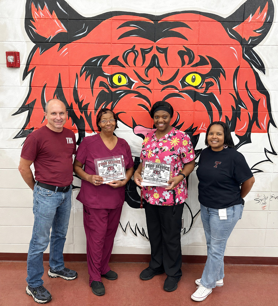 Denise Garner, Child Nutrition Program (CNP) Assistant, and Gachel Martin, CNP Manager at Thomasville High School, were recognized Sept. 25 for National Food Service Worker Appreciation Day. They are pictured with Jay Russell, THS Assistant Principal; and April Bouler, THS Principal.