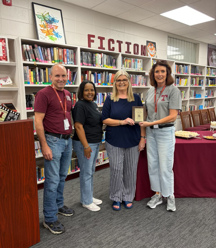 Cindy Hare, longtime secretary at Thomasville High School, who recently retired, was honored with a reception Sept. 25 in the school library. Pictured are Jay Russell, THS Assistant Principal; April Bouler, THS Principal; Cindy Hare; and Vickie Morris, Thomasville City School Superintendent.