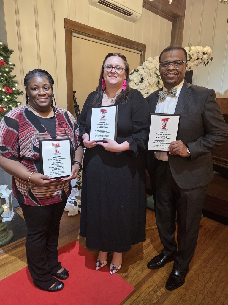 Ms. Jiles, Ms. Keziah, and Dr. Wynn with their plaques