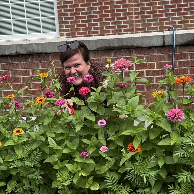 Mrs. Faulk with the Zinnias