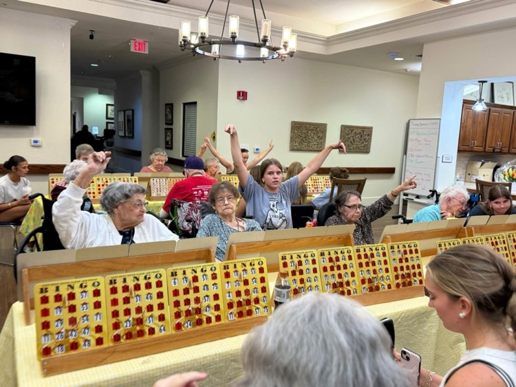 THS StuCo members playing Bingo with Taylor SPJST Skilled Nursing Facility residents.